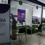 AIMA service counters inside an immigration office in Portugal