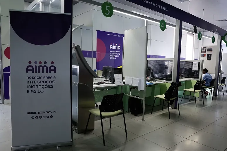 AIMA service counters inside an immigration office in Portugal